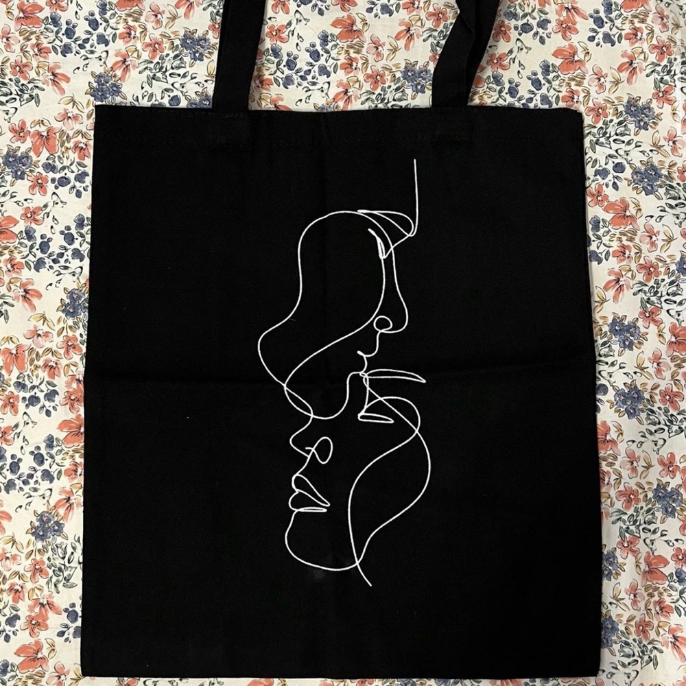 Black tote bag with line drawing